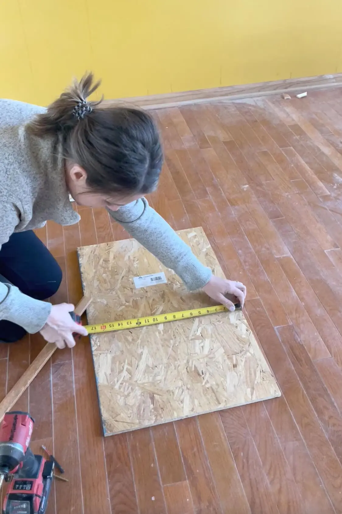 Measuring on a board to make an arched doorway. 